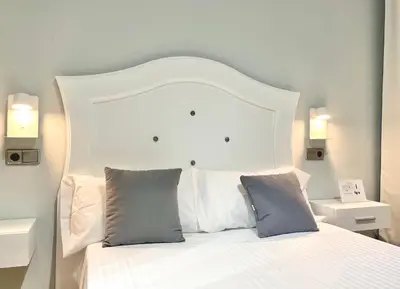 Cama o camas de una habitación en Hostal Los Ángeles