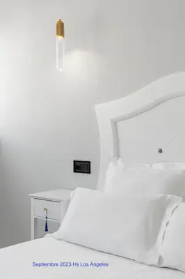 Cama o camas de una habitación en Hostal Los Ángeles