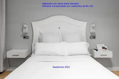 Cama o camas de una habitación en Hostal Los Ángeles