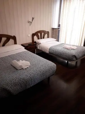 Cama o camas de una habitación en New Go Inn