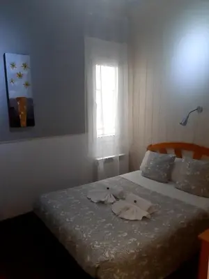 Cama o camas de una habitación en New Go Inn