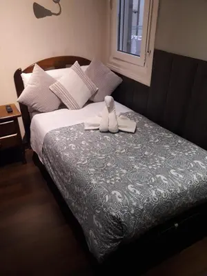 Cama o camas de una habitación en New Go Inn