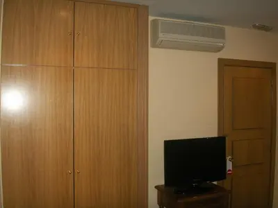 Una televisión o centro de entretenimiento en Hostal La Nava