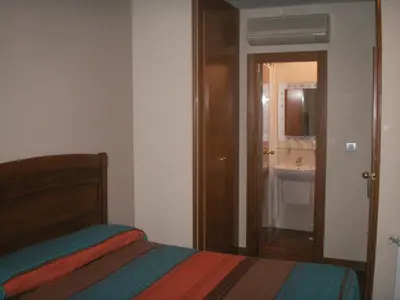 Cama o camas de una habitación en Hostal La Nava