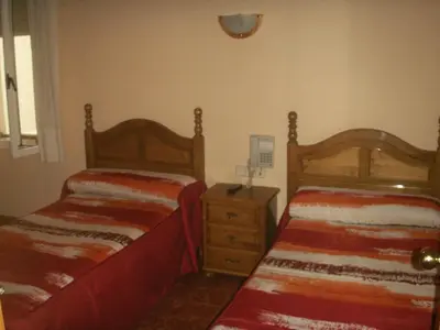 Cama o camas de una habitación en Hostal La Nava