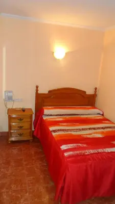 Cama o camas de una habitación en Hostal La Nava