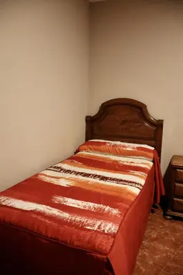 Cama o camas de una habitación en Hostal La Nava
