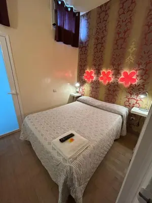 Cama o camas de una habitación en Casa de Huespedes Dolce Vita