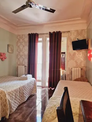 Cama o camas de una habitación en Casa de Huespedes Dolce Vita