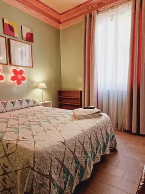 Cama o camas de una habitación en Casa de Huespedes Dolce Vita