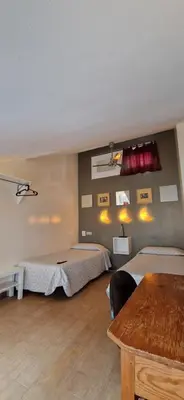 Cama o camas de una habitación en Casa de Huespedes Dolce Vita