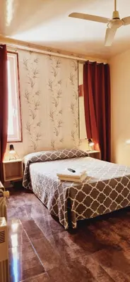 Cama o camas de una habitación en Casa de Huespedes Dolce Vita