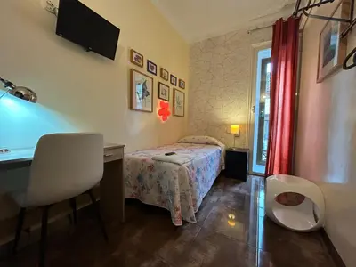 Cama o camas de una habitación en Casa de Huespedes Dolce Vita