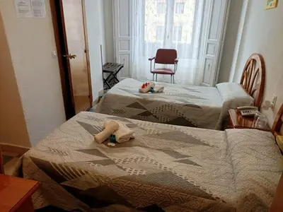 Cama o camas de una habitación en Hostal Continental
