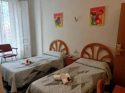 Cama o camas de una habitación en Hostal Continental