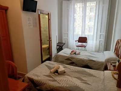 Cama o camas de una habitación en Hostal Continental