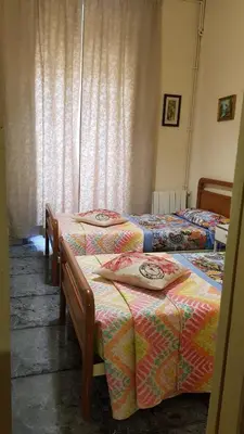 Cama o camas de una habitación en Hostal Loyola