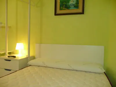 Cama o camas de una habitación en Hostal Loyola