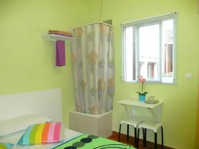 Cama o camas de una habitación en Hostal Loyola
