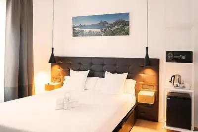 Cama o camas de una habitación en Woohoo Rooms Chueca