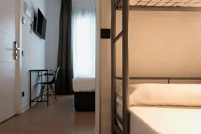 Cama o camas de una habitación en Woohoo Rooms Chueca