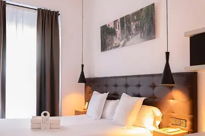 Cama o camas de una habitación en Woohoo Rooms Chueca