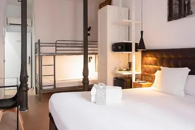 Cama o camas de una habitación en Woohoo Rooms Chueca