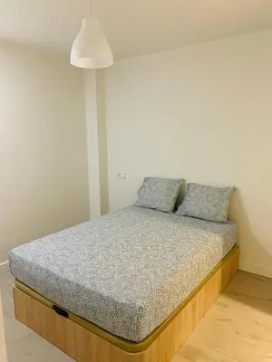 Cama o camas de una habitación en Pisos con Piscina Barrio Exclusivo-MOVISTAR ARENA alquiler temporada