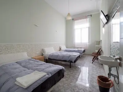 Cama o camas de una habitación en Pensión Apolo XI
