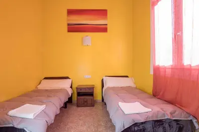 Cama o camas de una habitación en Pensión Apolo XI