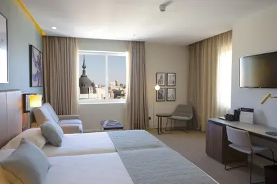 Cama o camas de una habitación en Riu Plaza España