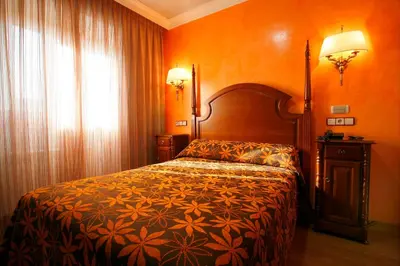 Cama o camas de una habitación en Hostal Victoria I