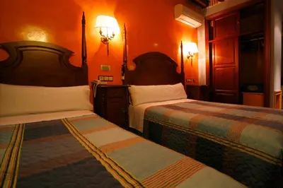 Cama o camas de una habitación en Hostal Victoria I