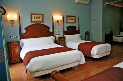 Cama o camas de una habitación en Hostal Victoria II
