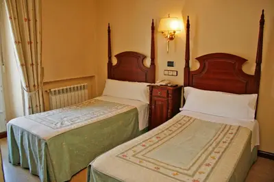 Cama o camas de una habitación en Hostal Victoria II