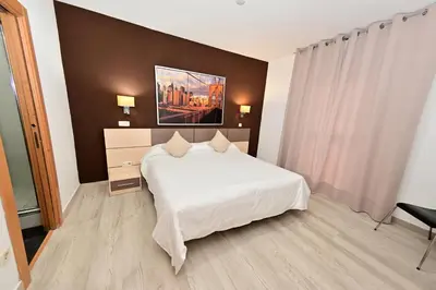 Cama o camas de una habitación en Hostal Falfes