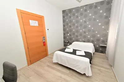 Cama o camas de una habitación en Hostal Falfes