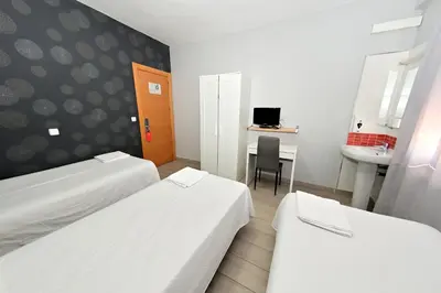 Cama o camas de una habitación en Hostal Falfes
