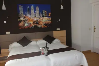 Cama o camas de una habitación en Hostal Falfes