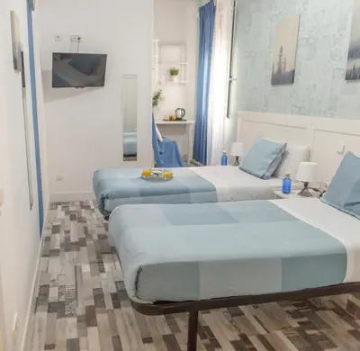 Cama o camas de una habitación en Fuencarral Adeco