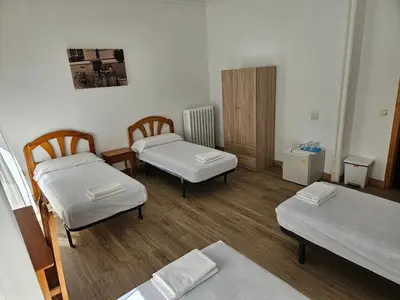 Cama o camas de una habitación en Hostal Miralva