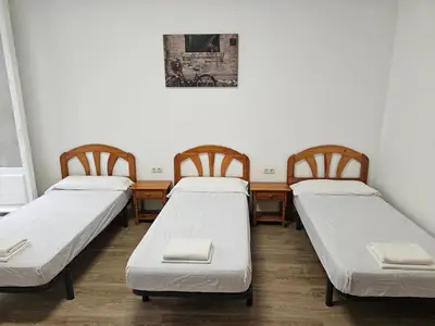 Cama o camas de una habitación en Hostal Miralva
