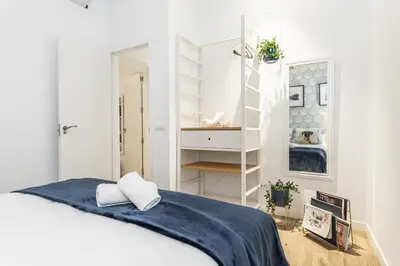 Cama o camas de una habitación en Waou GRAN VIA es MIA - Corta Duración