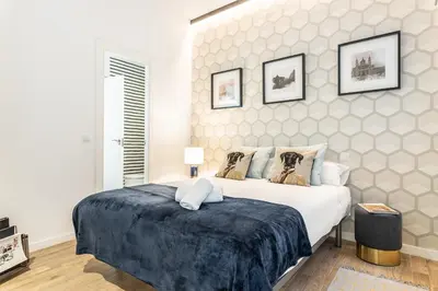 Cama o camas de una habitación en Waou GRAN VIA es MIA - Corta Duración
