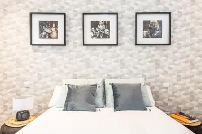 Cama o camas de una habitación en Waou GRAN VIA es MIA - Corta Duración