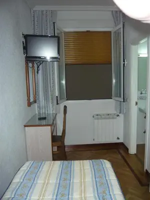 Cama o camas de una habitación en Hostal Triana