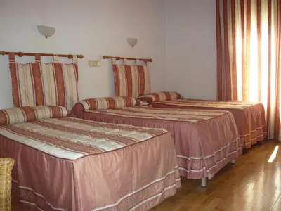 Cama o camas de una habitación en Hostal Triana