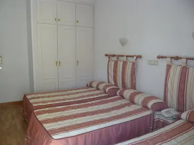Cama o camas de una habitación en Hostal Triana