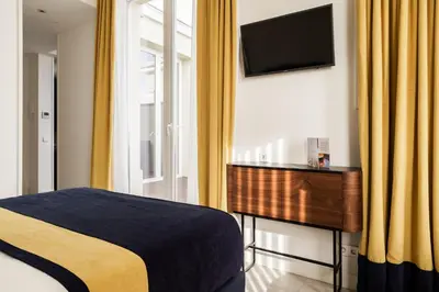 Cama o camas de una habitación en Smartrental Collection Gran Vía Centric