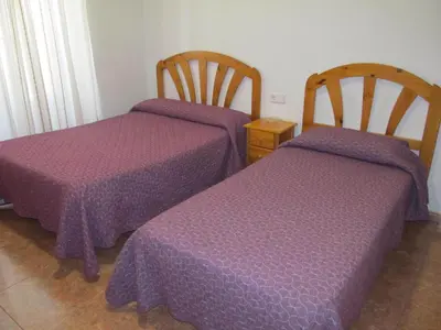 Cama o camas de una habitación en Hostal Las Torres